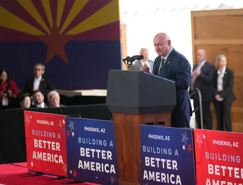 U.S. Sen. Mark Kelly (R-Ariz.) speaks before President Joe Biden at Taiwan Semiconductor Manufacturing Co. under construction in Phoenix on Dec. 6, 2022.